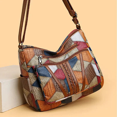 Bolso de mano de piel con mosaico